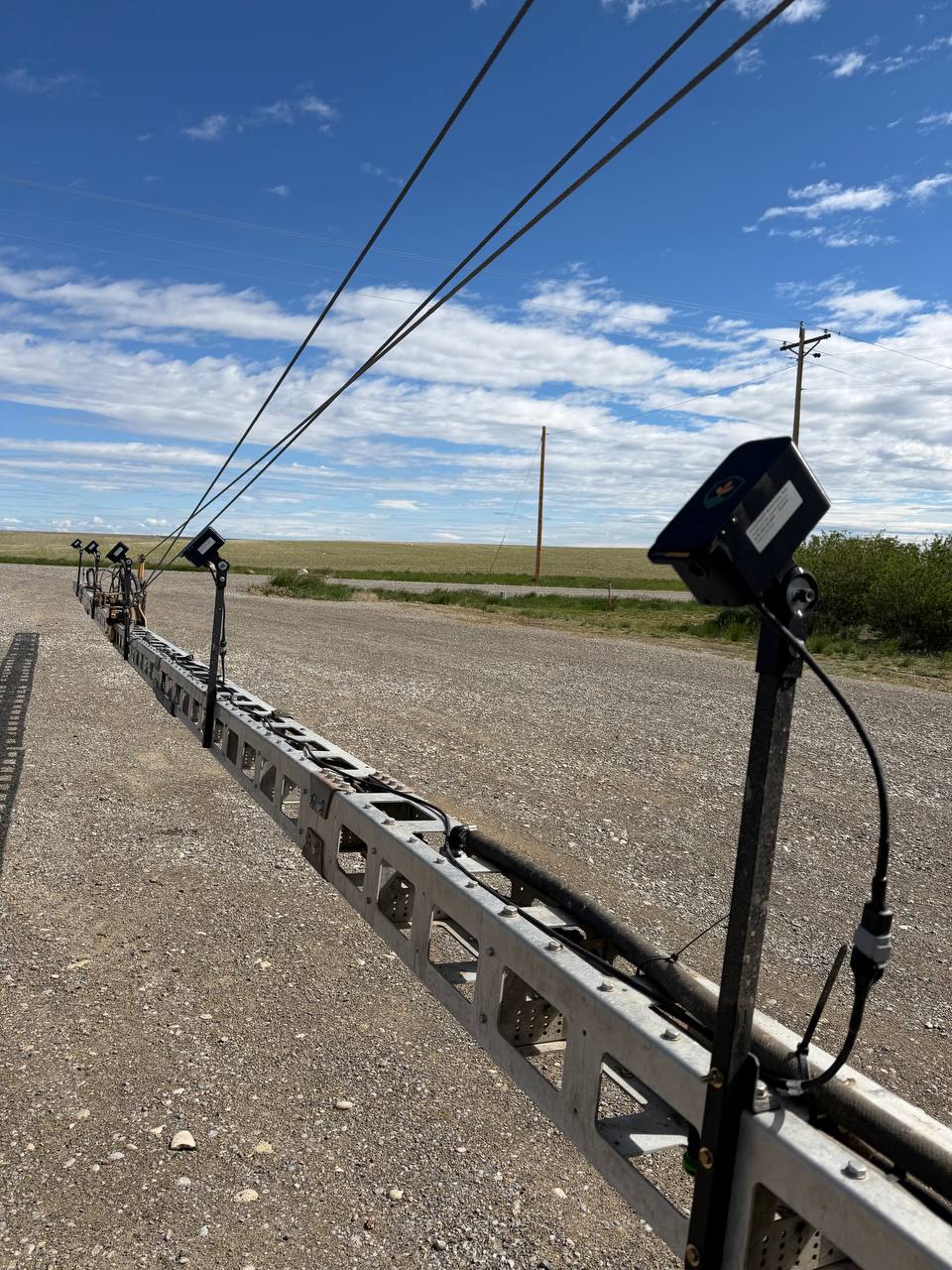 FarmDefender cameras mounted across a sprayer boom in Montana