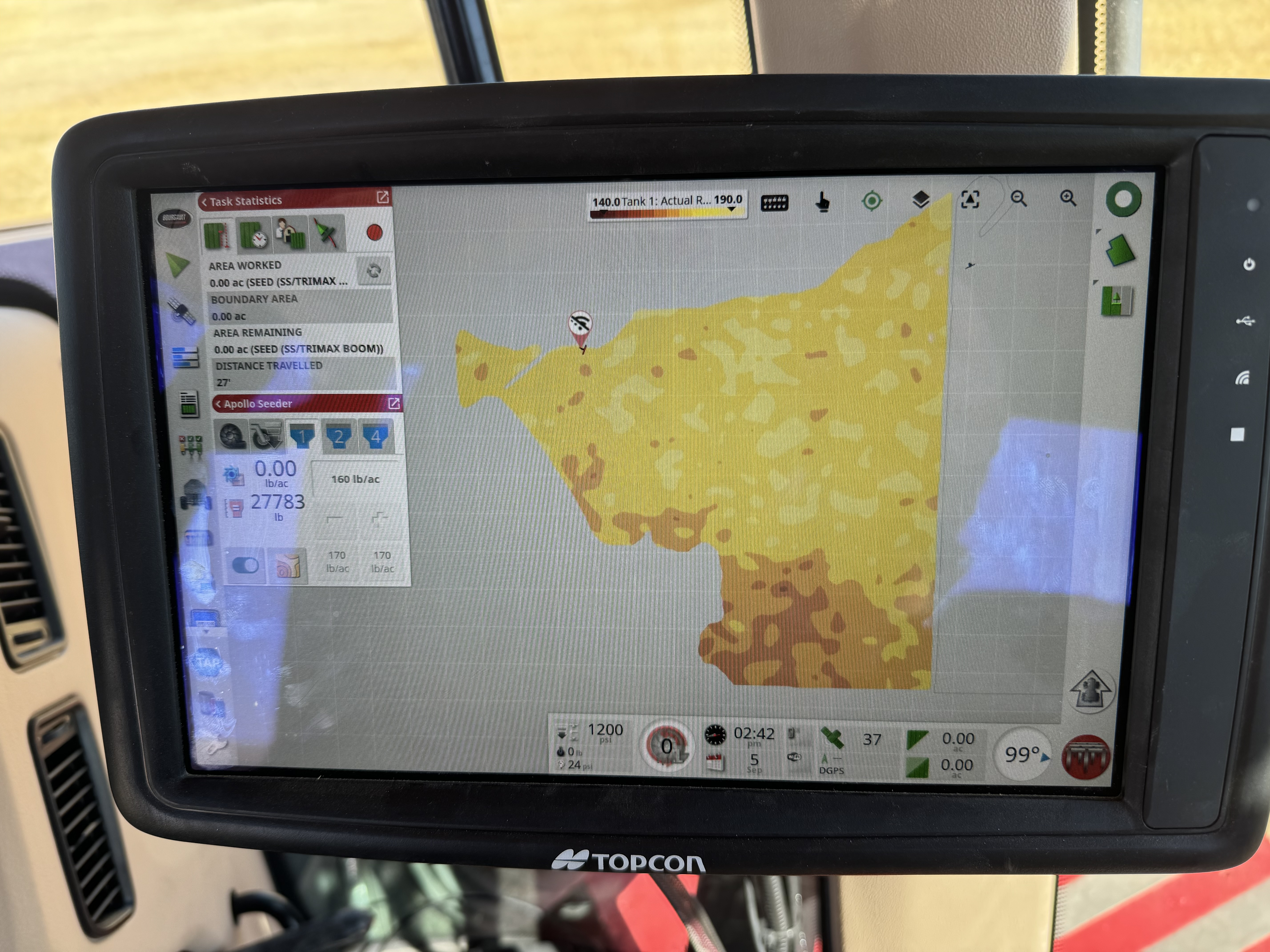 Topcon console in the cab with a variable-rate prescription built from SoilOptix data loaded and ready to apply